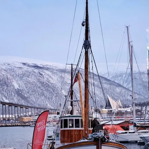 An old wooden fishing boat moored at the quay